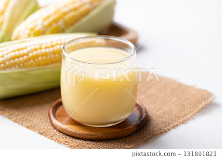 Sweetcorn milk in glass and fresh sweetcorn, Alternative milk from plant, dairy free 131891821