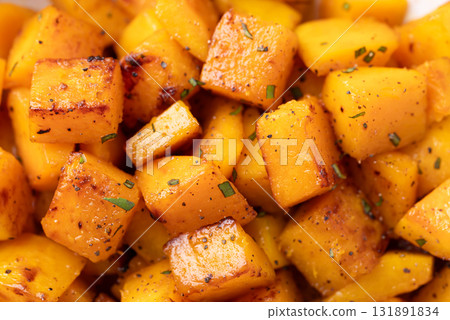 Roasted butternut squash pumpkin texture background, Autumn homemade food Roasted butternut squash pumpkin texture background, Autumn homemade food 131891834