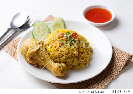 Thai Biryani rice with chicken and chili sauce on white background Thai Biryani rice with chicken and chili sauce on white background 131891839