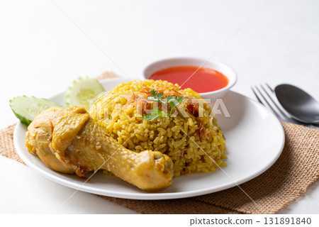 Thai Biryani rice with chicken and chili sauce on white background Thai Biryani rice with chicken and chili sauce on white background 131891840
