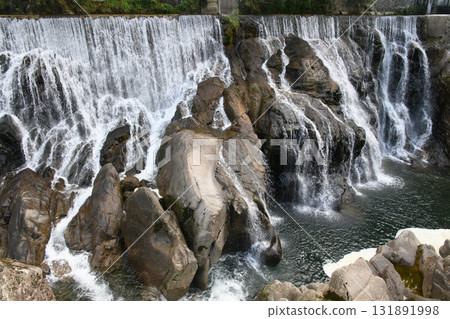 Flowing water from Nagashino Dam 131891998