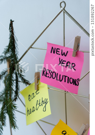 Vision board with new year resolutions aims goals on sticky notes. Preparation for New Year. Planning and setting goals for personal development Vision board with new year resolutions aims goals on sticky notes. Preparation for New Year. Planning and setting goals for personal development 131892267