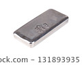 Silver bar, side view, isolated, over white. Cast silver ingot, stamped with 1 kg for one kilogram, about 32 troy oz of metal, and with a purity of 999.0, corresponding 99.9 percent pure silver. Photo 131893935