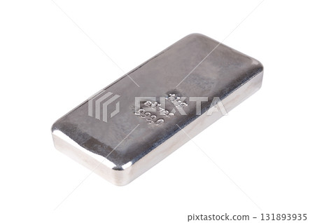 Silver bar, side view, isolated, over white. Cast silver ingot, stamped with 1 kg for one kilogram, about 32 troy oz of metal, and with a purity of 999.0, corresponding 99.9 percent pure silver. Photo 131893935