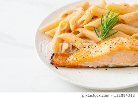 salmon with penne pasta cream sauce salmon with penne pasta cream sauce 131894318