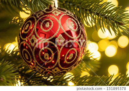 Red Christmas Ornament with Golden Pattern on Tree Red Christmas Ornament with Golden Pattern on Tree 131895378