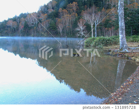 Lake Onuma / Early morning lake surface scenery transitioning from late autumn to early winter - Windless Lake Onuma, Shiga Kogen National Park 131895728