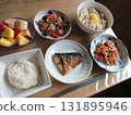 A classic Japanese menu featuring grilled fish (salted mackerel) and a combination of small dishes, with a daily set meal 131895946