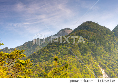 Fresh green mountains and the rising sun, Western Forest Road Area, Yakushima, a World Natural Heritage Site Fresh green mountains and the rising sun, Western Forest Road Area, Yakushima, a World Natural Heritage Site 131896156