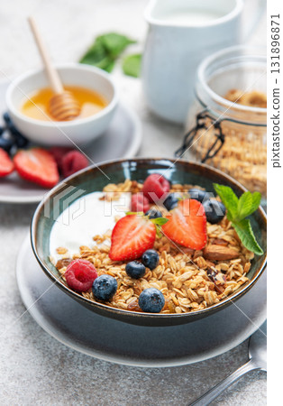 Healthy breakfast bowl with granola, yogurt, and berries Healthy breakfast bowl with granola, yogurt, and berries 131896871