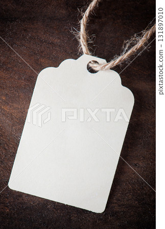 label on a wooden beige background label on a wooden beige background 131897010