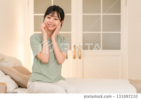 Young Asian woman doing skin care and night care before going to bed at night Young Asian woman doing skin care and night care before going to bed at night 131897210