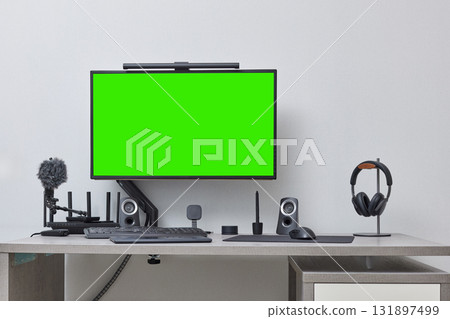 modern comfortable workspace for remote work. empty green computer pc and setup for freelancer from home office modern comfortable workspace for remote work. empty green computer pc and setup for freelancer from home office 131897499