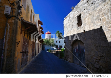 Beautiful old town of Rhodes on the Greek island of Rhodes. Beautiful historical architecture with castle, shops and cafes. Concept for travel and vacation. 131897667