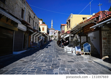 Beautiful old town of Rhodes on the Greek island of Rhodes. Beautiful historical architecture with castle, shops and cafes. Concept for travel and vacation. 131897669