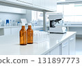 Laboratory Scene with Amber Glass Bottles and Clear Vials on a Clean White Countertop 131897773