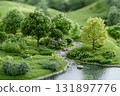 Lush Green Landscape with Trees and Serene Stream Flowing through a Tranquil Scene 131897776