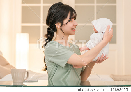Bedroom, mother holding baby in bedroom (soothing, putting to sleep, childcare) Bedroom, mother holding baby in bedroom (soothing, putting to sleep, childcare) 131898455