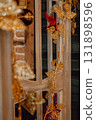 decorative golden ornaments and plants adorn wooden display in festive setting. closeup. 131898596