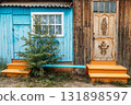 colorful wooden house facade with vibrant blue and orange steps in rural setting. closeup. 131898597