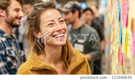 Woman smiling during collaborative brainstorming workshop 131898639