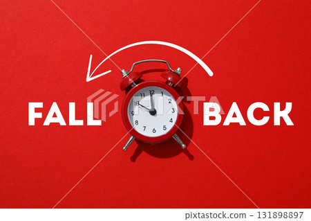 Classic red alarm clock shows time adjustment concept Classic red alarm clock shows time adjustment concept 131898897