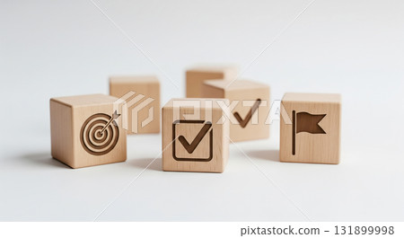 Business success concept with key element for goal achievement on white background. Wood block with target, check mark and milestone icon for strategic planning 131899998