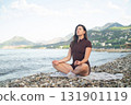 Morning yoga by the sea calmness harmony and connection with nature promoting wellness and relaxation 131901119