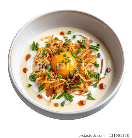 Silky Leek and Potato Veloute Soup with Crispy Leek Threads and Quenelle of Sour Cream in Shallow Bowl 131901538