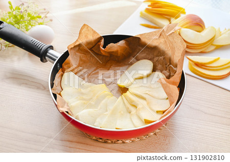 Apple slices in a frying pan 131902810