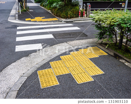 Example of braille block installation in front of a pedestrian crossing 131903110