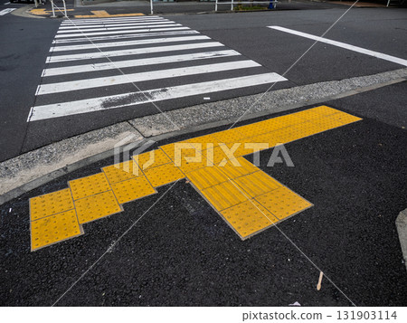 Example of braille block installation in front of a pedestrian crossing 131903114