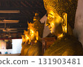 Row of Golden Buddha Statues in Thai Temple 131903481