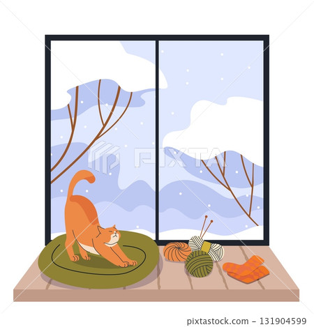 Cozy orange cat stretching on cushion by snowy window with yarn balls knitting needles and warm socks winter home interior scene 131904599
