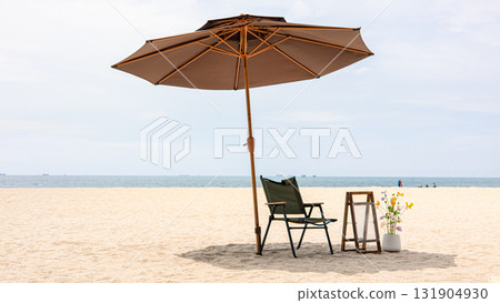 Beach chair and umbrella on sand with sea view and summer vacation relaxation concept 131904930