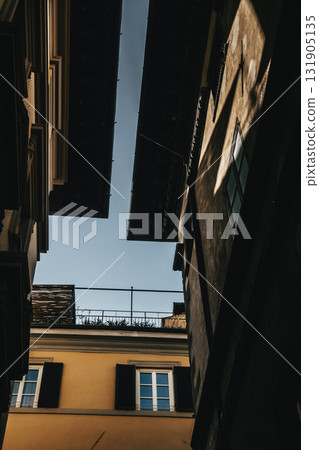 Narrow Alleyway with Architectural Shadows Narrow Alleyway with Architectural Shadows 131905135