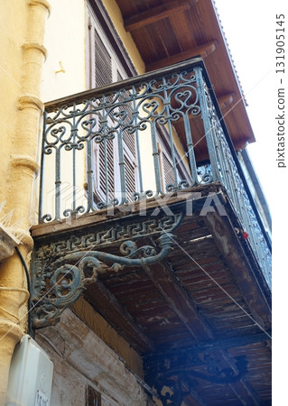 Ornate Antique Wrought Iron Balcony Fence on Building 131905145