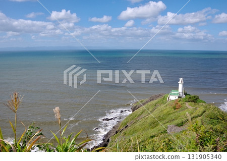 View of Cape Kakuda Lighthouse and the Sea of Japan from the hiking trail on Mount Kakuda in Niigata Prefecture 131905340