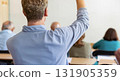 Back view of older student raising his hand to answer teacher's question during education training class. jpg ai image 131905359
