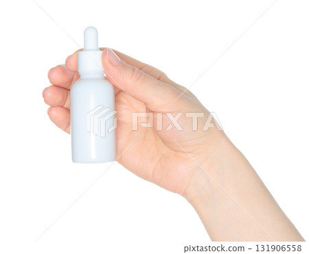 Human hand holding white cosmetic bottle isolated on transparent background 131906558