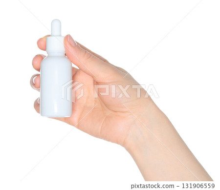 Human hand holding white cosmetic bottle isolated on transparent background 131906559