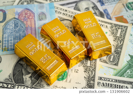 Gold bars with US dollar and Euro banknote money, finance trading investment business currency. Gold bars with US dollar and Euro banknote money, finance trading investment business currency. 131906602