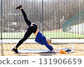 Athletic woman practicing three legged down dog pose increasing flexibility 131906659