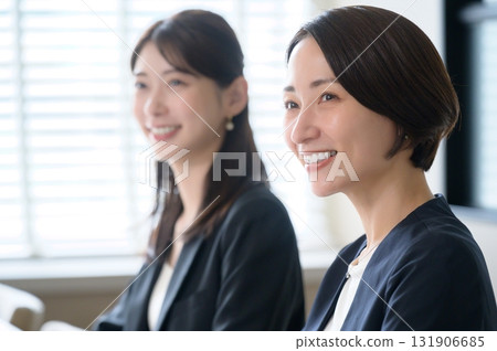 Two women working in an office 131906685