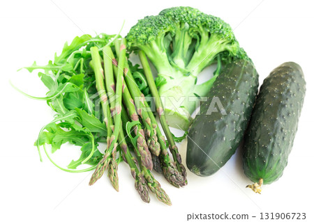 still life from green farm vegetables, arugula, broccoli, asparagus and cucumbers on white background 131906723