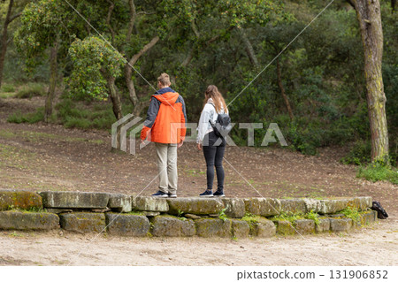 Young couple exploring nature on woodland hike 131906852