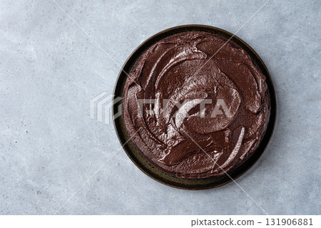 Chocolate cake with dark chocolate ganache topping Chocolate cake with dark chocolate ganache topping 131906881