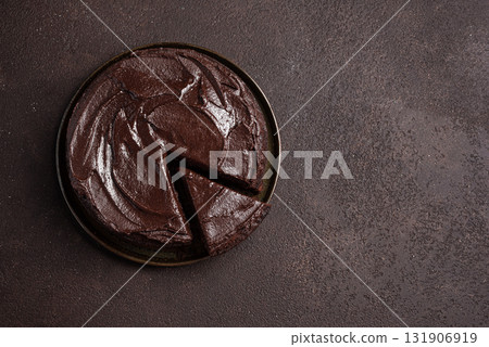 Chocolate brownie cake with rich chocolate topping 131906919