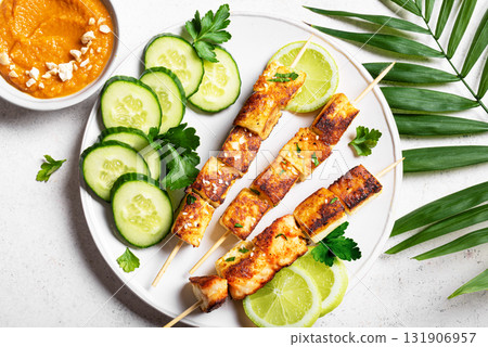 Grilled tofu satay skewers and peanut spicy sauce Grilled tofu satay skewers and peanut spicy sauce 131906957