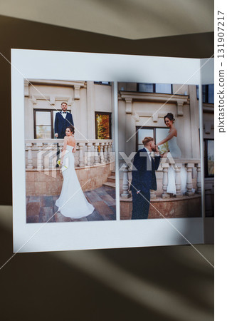 page of an open photo book with wedding photos on a white table page of an open photo book with wedding photos on a white table 131907217